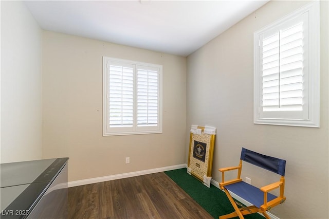 10711 Silver Pond Ave, Las Vegas, NV 89135 - living area featuring dark wood-style floors and baseboards