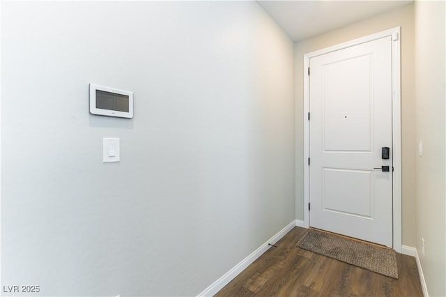 10711 Silver Pond Ave, Las Vegas, NV 89135 - doorway to outside featuring baseboards and dark wood-style flooring