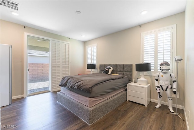 10711 Silver Pond Ave, Las Vegas, NV 89135 - bedroom with access to outside, dark wood-type flooring, recessed lighting, and freestanding refrigerator