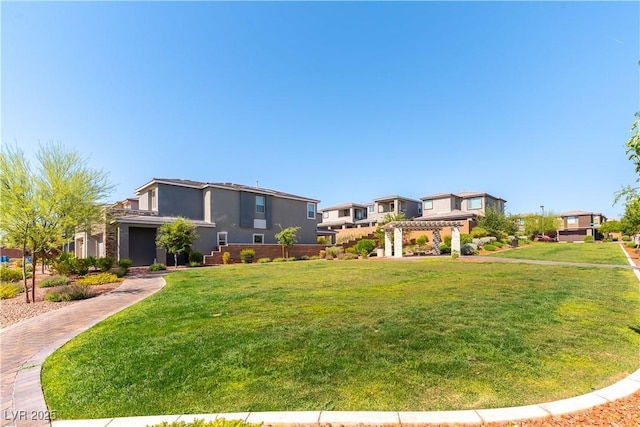 10711 Silver Pond Ave, Las Vegas, NV 89135 - view of front of property with stucco siding, a front lawn, a pergola, and stone siding
