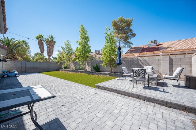 1553 Bright View Dr, Las Vegas, NV 89119 - fenced backyard with a patio and an outdoor hangout area