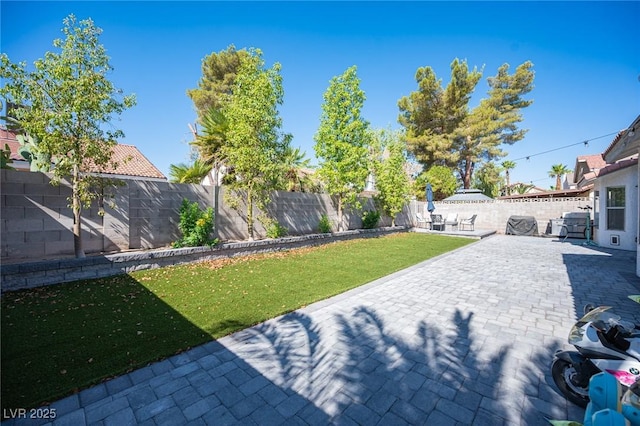 1553 Bright View Dr, Las Vegas, NV 89119 - fenced backyard with a patio