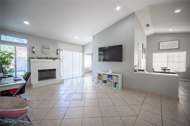 1553 Bright View Dr, Las Vegas, NV 89119 - living room featuring lofted ceiling, tile patterned floors, recessed lighting, and a brick fireplace