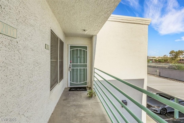 7100 Pirates Cove Rd Unit 2076, Las Vegas, NV 89145 - property entrance with stucco siding and a balcony