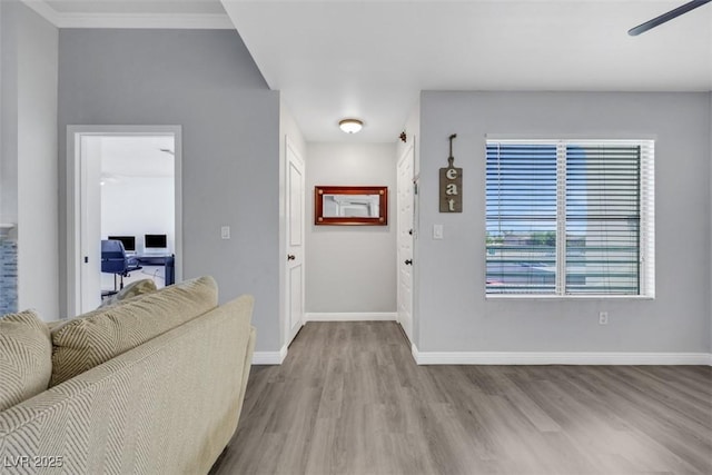 7100 Pirates Cove Rd Unit 2076, Las Vegas, NV 89145 - entryway with wood finished floors, a ceiling fan, and crown molding