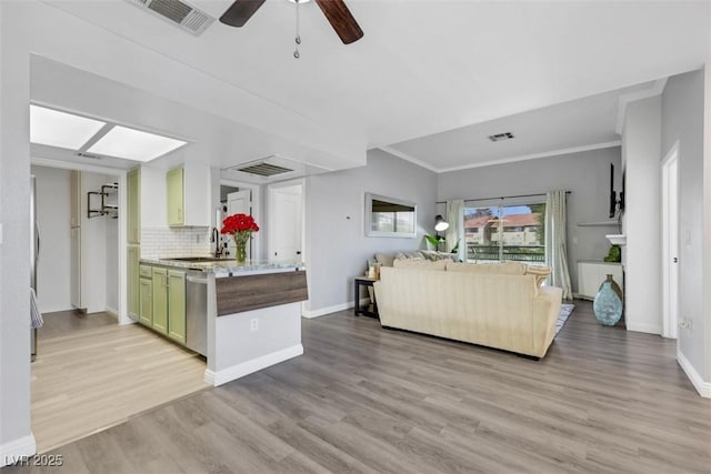 7100 Pirates Cove Rd Unit 2076, Las Vegas, NV 89145 - living area featuring light wood finished floors, a ceiling fan, and crown molding