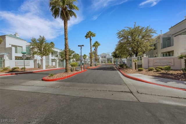 7100 Pirates Cove Rd Unit 2076, Las Vegas, NV 89145 - view of asphalt road featuring a residential view, sidewalks, and curbs