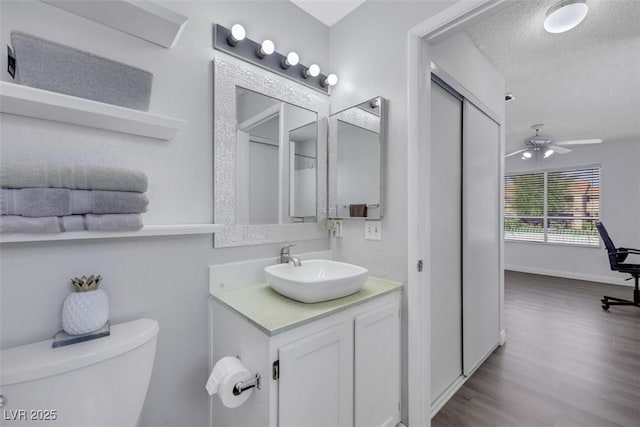 7100 Pirates Cove Rd Unit 2076, Las Vegas, NV 89145 - bathroom with vanity, ceiling fan, and wood finished floors
