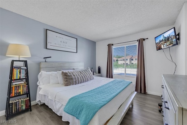 7100 Pirates Cove Rd Unit 2076, Las Vegas, NV 89145 - bedroom featuring wood finished floors and a textured ceiling