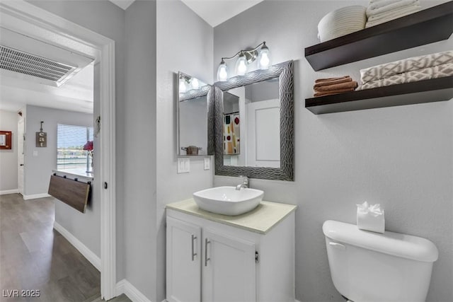 7100 Pirates Cove Rd Unit 2076, Las Vegas, NV 89145 - bathroom featuring wood finished floors and vanity