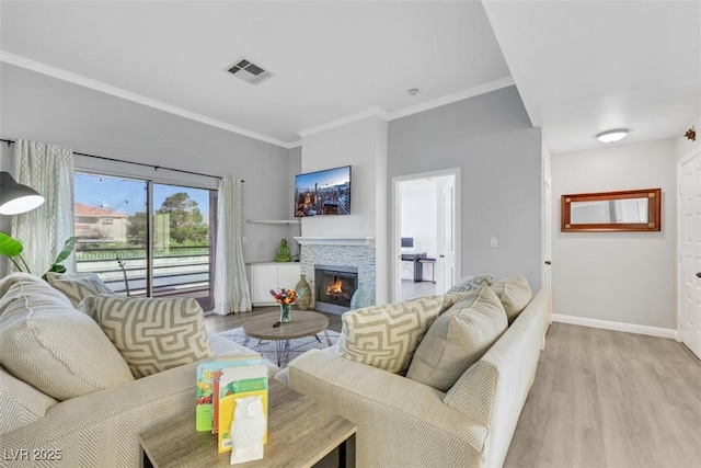 7100 Pirates Cove Rd Unit 2076, Las Vegas, NV 89145 - living area with wood finished floors, ornamental molding, and a glass covered fireplace