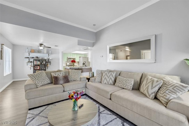 7100 Pirates Cove Rd Unit 2076, Las Vegas, NV 89145 - living area with wood finished floors, crown molding, and a ceiling fan