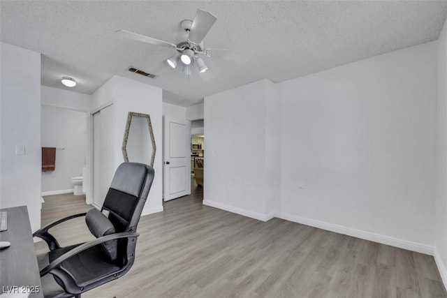 7100 Pirates Cove Rd Unit 2076, Las Vegas, NV 89145 - office area with wood finished floors, a textured ceiling, and a ceiling fan