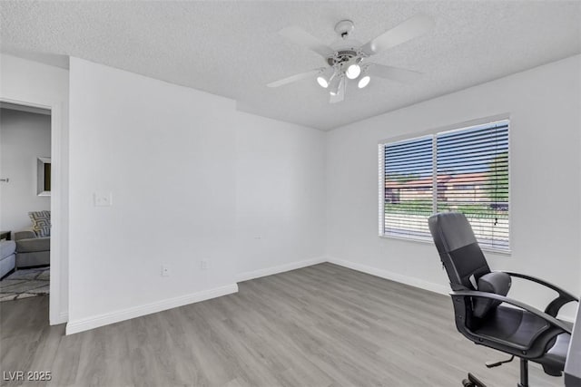 7100 Pirates Cove Rd Unit 2076, Las Vegas, NV 89145 - unfurnished office featuring a textured ceiling, wood finished floors, and a ceiling fan
