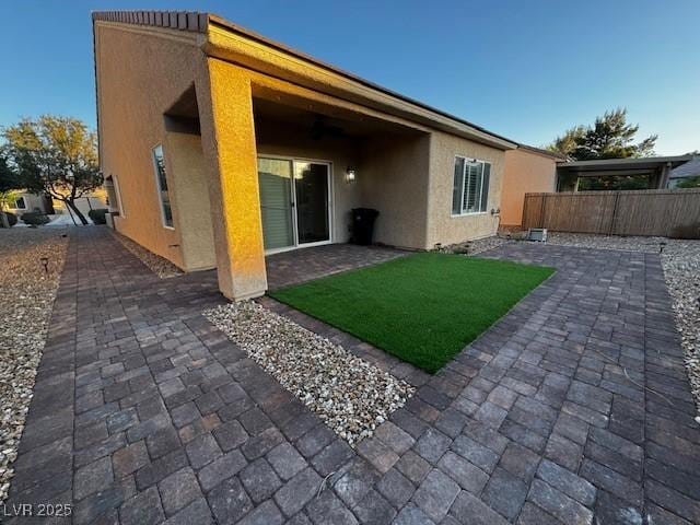 2704 Willow Wren Dr, North Las Vegas, NV 89084 - back of house with stucco siding and a patio area
