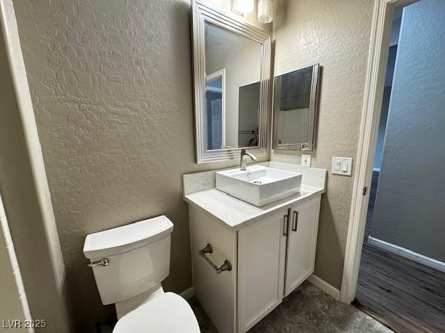 2704 Willow Wren Dr, North Las Vegas, NV 89084 - half bath with a textured wall and vanity