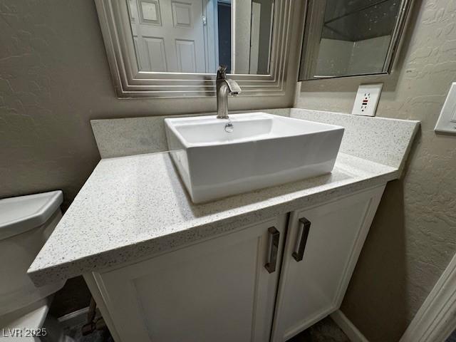 2704 Willow Wren Dr, North Las Vegas, NV 89084 - bathroom with a textured wall and vanity