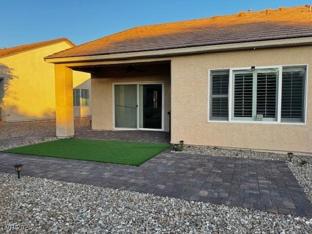 2704 Willow Wren Dr, North Las Vegas, NV 89084 - rear view of property featuring stucco siding and a patio