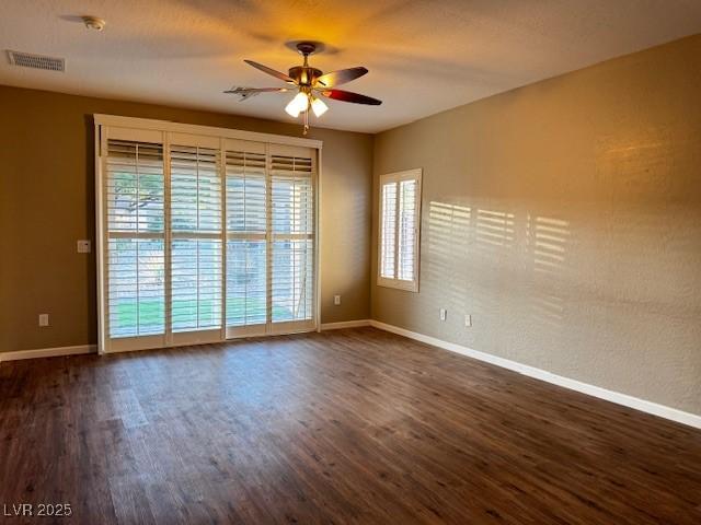 2704 Willow Wren Dr, North Las Vegas, NV 89084 - empty room with ceiling fan and dark wood-style flooring