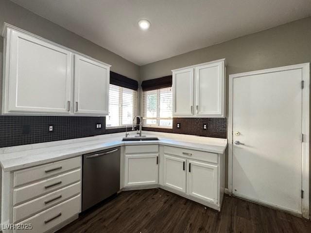 2704 Willow Wren Dr, North Las Vegas, NV 89084 - kitchen featuring stainless steel dishwasher, dark wood-style flooring, white cabinets, decorative backsplash, and recessed lighting
