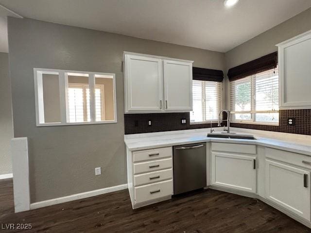 2704 Willow Wren Dr, North Las Vegas, NV 89084 - kitchen featuring stainless steel dishwasher, backsplash, white cabinetry, and dark wood finished floors