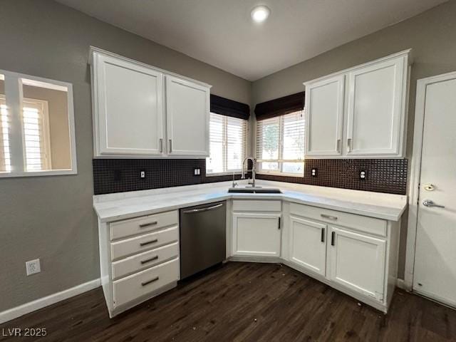 2704 Willow Wren Dr, North Las Vegas, NV 89084 - kitchen with stainless steel dishwasher, dark wood-type flooring, white cabinetry, and backsplash