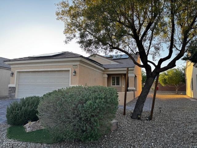 2704 Willow Wren Dr, North Las Vegas, NV 89084 - view of front of property featuring a garage and stucco siding