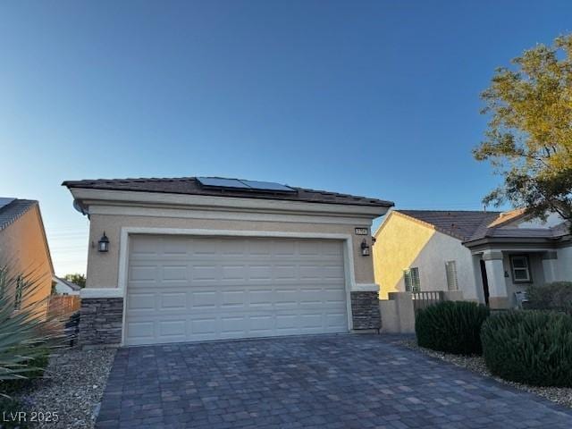 2704 Willow Wren Dr, North Las Vegas, NV 89084 - garage with solar panels and driveway