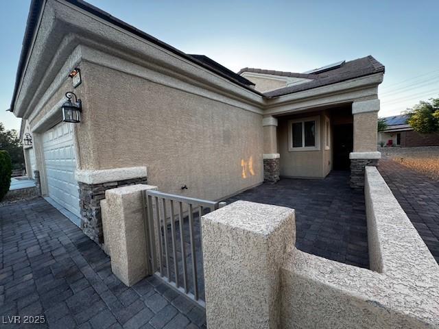 2704 Willow Wren Dr, North Las Vegas, NV 89084 - view of home's exterior featuring stucco siding and an attached garage