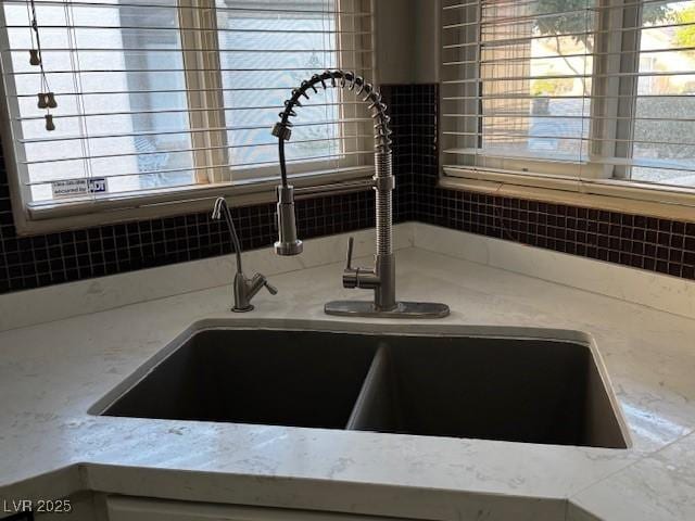 2704 Willow Wren Dr, North Las Vegas, NV 89084 - kitchen view of a sink and light stone counters