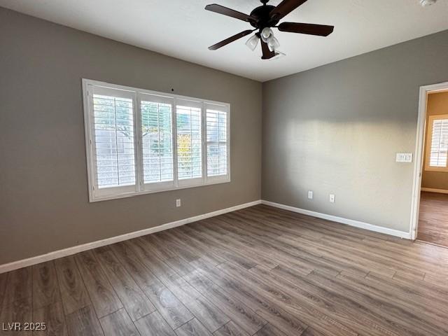 2704 Willow Wren Dr, North Las Vegas, NV 89084 - empty room with healthy amount of natural light, ceiling fan, and wood finished floors