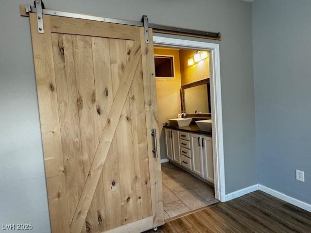 2704 Willow Wren Dr, North Las Vegas, NV 89084 - bathroom with double vanity and wood finished floors