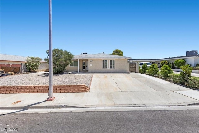 321 Oil Lantern Ln, Las Vegas, NV 89145 - ranch-style home with brick siding and concrete driveway