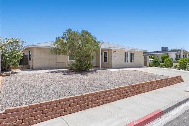 321 Oil Lantern Ln, Las Vegas, NV 89145 - single story home featuring brick siding and concrete driveway