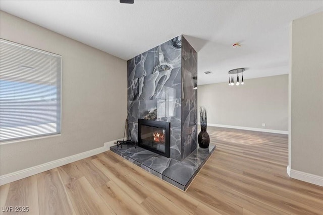 321 Oil Lantern Ln, Las Vegas, NV 89145 - detailed view of wood finished floors and a fireplace