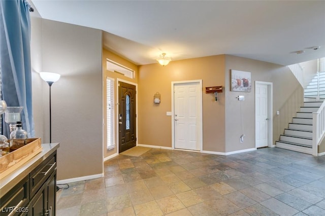 4512 Long Horse Ct, Las Vegas, NV 89147 - entrance foyer with stone tile flooring and stairway