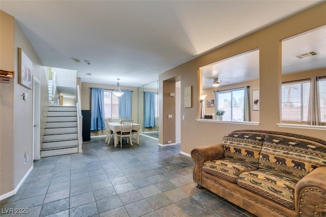 4512 Long Horse Ct, Las Vegas, NV 89147 - living area featuring stairs, stone tile floors, and a ceiling fan
