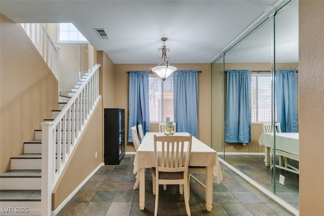 4512 Long Horse Ct, Las Vegas, NV 89147 - dining area with stone finish floors and stairs