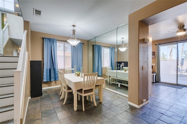 4512 Long Horse Ct, Las Vegas, NV 89147 - dining space with stone tile flooring, plenty of natural light, and stairs