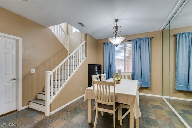 4512 Long Horse Ct, Las Vegas, NV 89147 - dining area with stairs and stone finish flooring