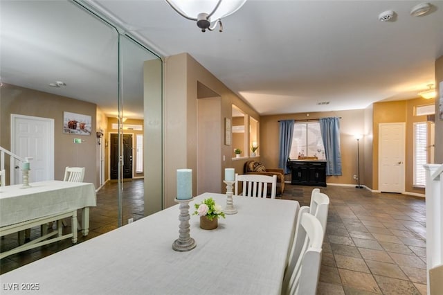 4512 Long Horse Ct, Las Vegas, NV 89147 - dining room featuring stone tile floors