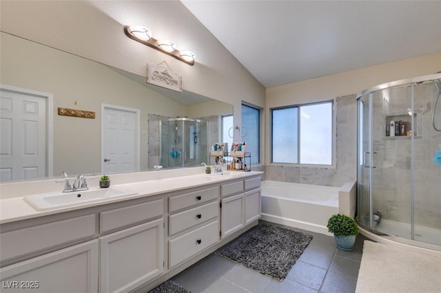 4512 Long Horse Ct, Las Vegas, NV 89147 - full bath with tile patterned floors, lofted ceiling, a stall shower, double vanity, and a bath