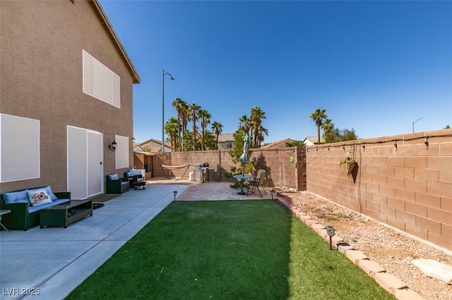 4512 Long Horse Ct, Las Vegas, NV 89147 - fenced backyard featuring a patio area and an outdoor living space