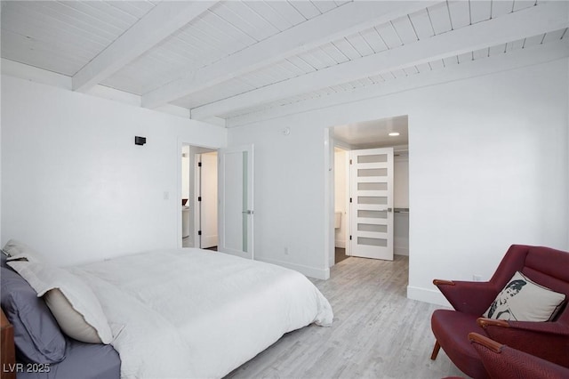 4778 Knotty Pine Way, Las Vegas, NV 89124 - bedroom with wood finished floors, beamed ceiling, and a walk in closet