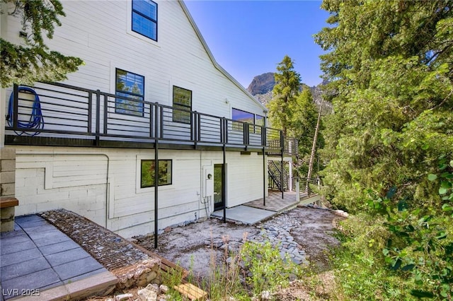 4778 Knotty Pine Way, Las Vegas, NV 89124 - rear view of house with a patio, a balcony, and a mountain view
