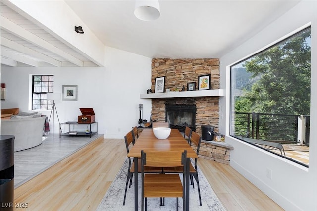 4778 Knotty Pine Way, Las Vegas, NV 89124 - dining space with wood finished floors, a fireplace, and vaulted ceiling