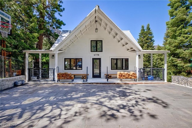 4778 Knotty Pine Way, Las Vegas, NV 89124 - rear view of property featuring a porch