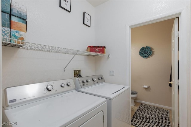 6170 E Sahara Ave Unit 1076, Las Vegas, NV 89142 - laundry room featuring washer and clothes dryer and light tile patterned floors