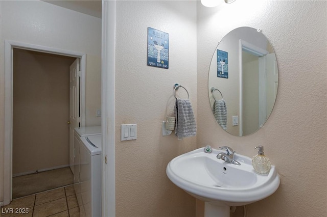6170 E Sahara Ave Unit 1076, Las Vegas, NV 89142 - bathroom with washer and clothes dryer and tile patterned flooring