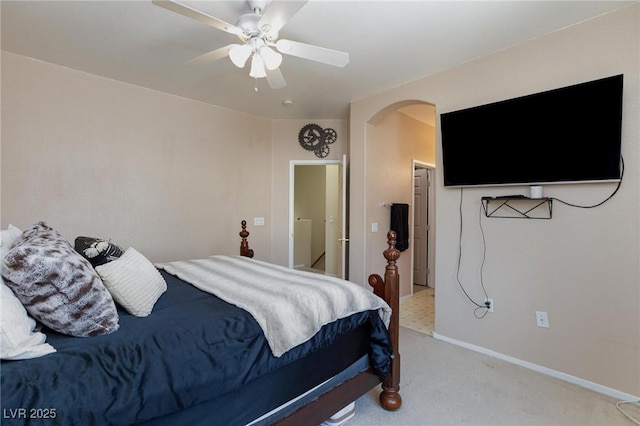 6170 E Sahara Ave Unit 1076, Las Vegas, NV 89142 - bedroom with arched walkways, light carpet, and a ceiling fan